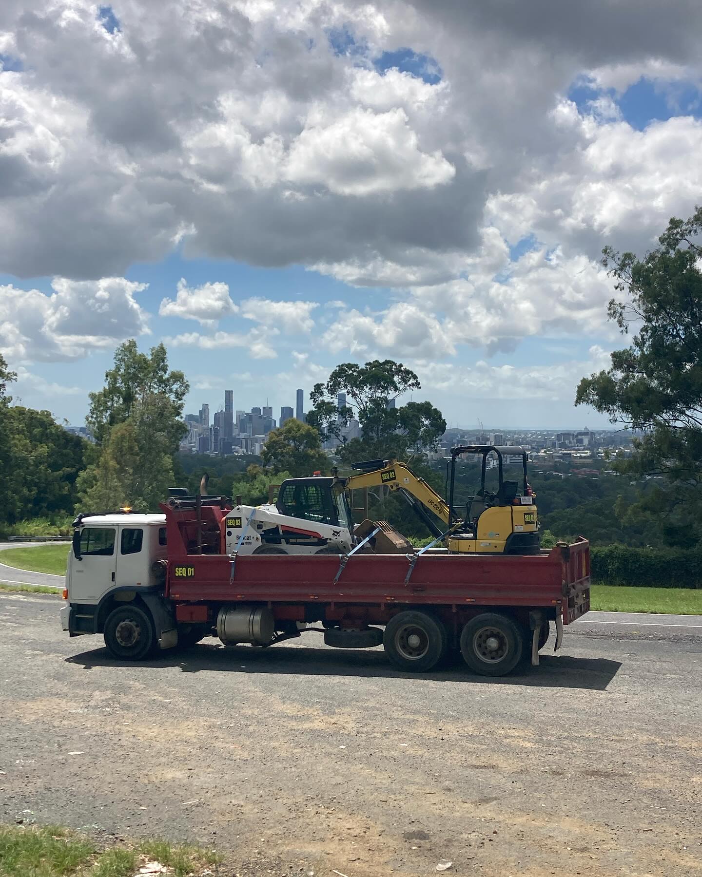 SEQ Dirtworks truck with Brisbane skyline